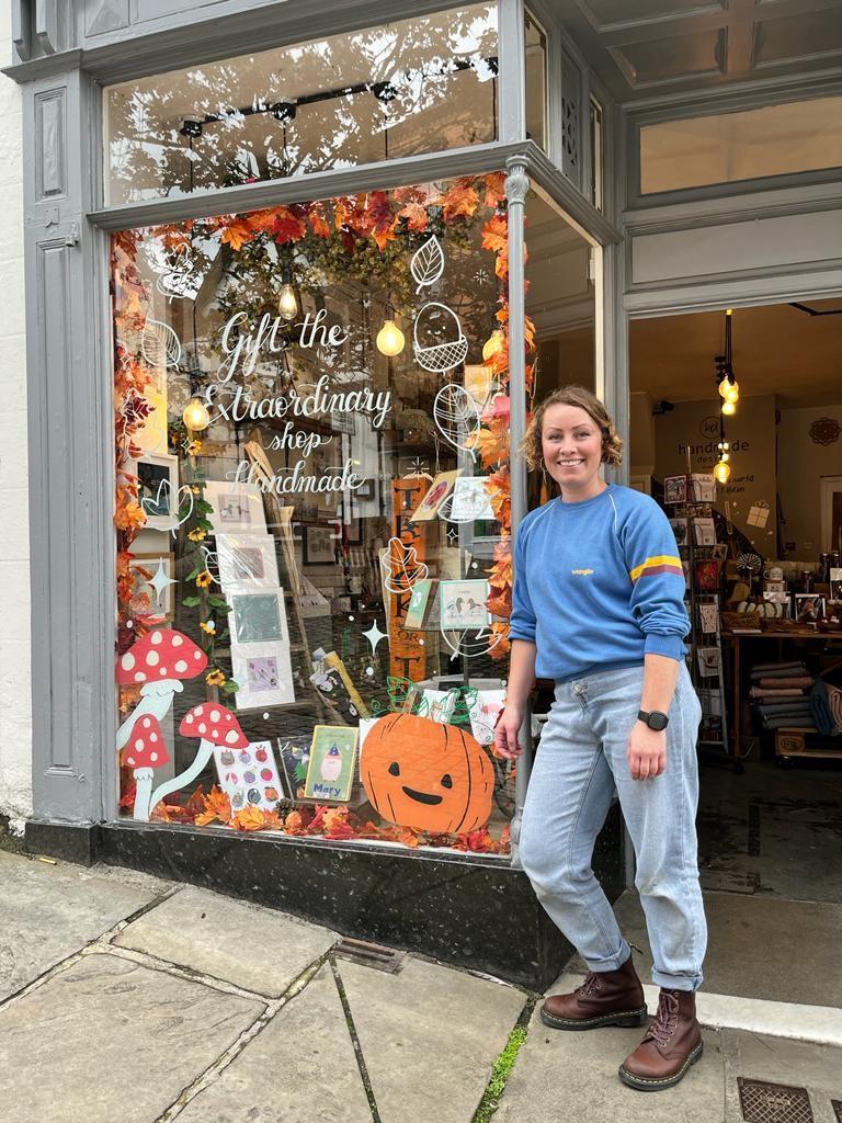 Sophie from Duck & Peach with her Halloween themed shop window display